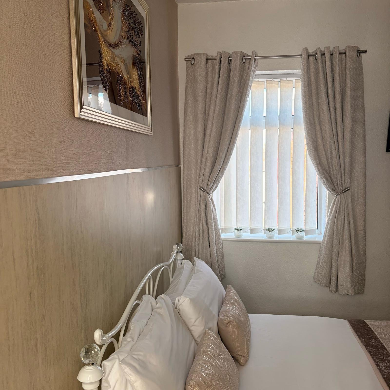 Comfortable upgraded bedroom at Sandringham Court Hotel